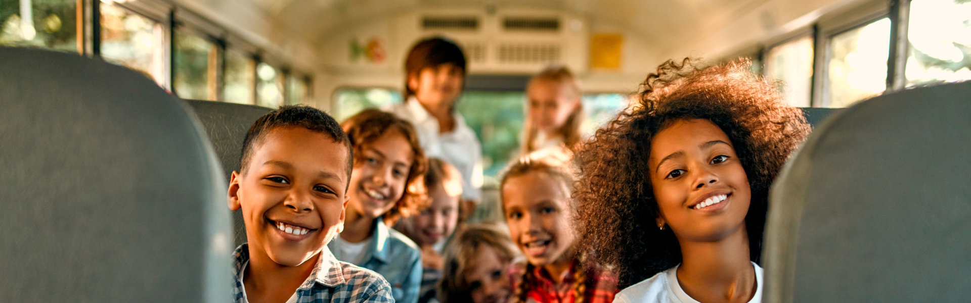 a group of kids on a bus